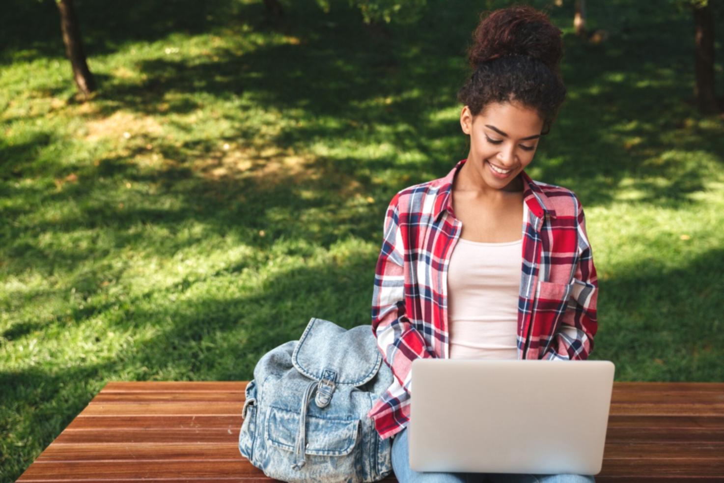 Modern office environment with collaborative workspaces and content optimization tools displayed on monitors